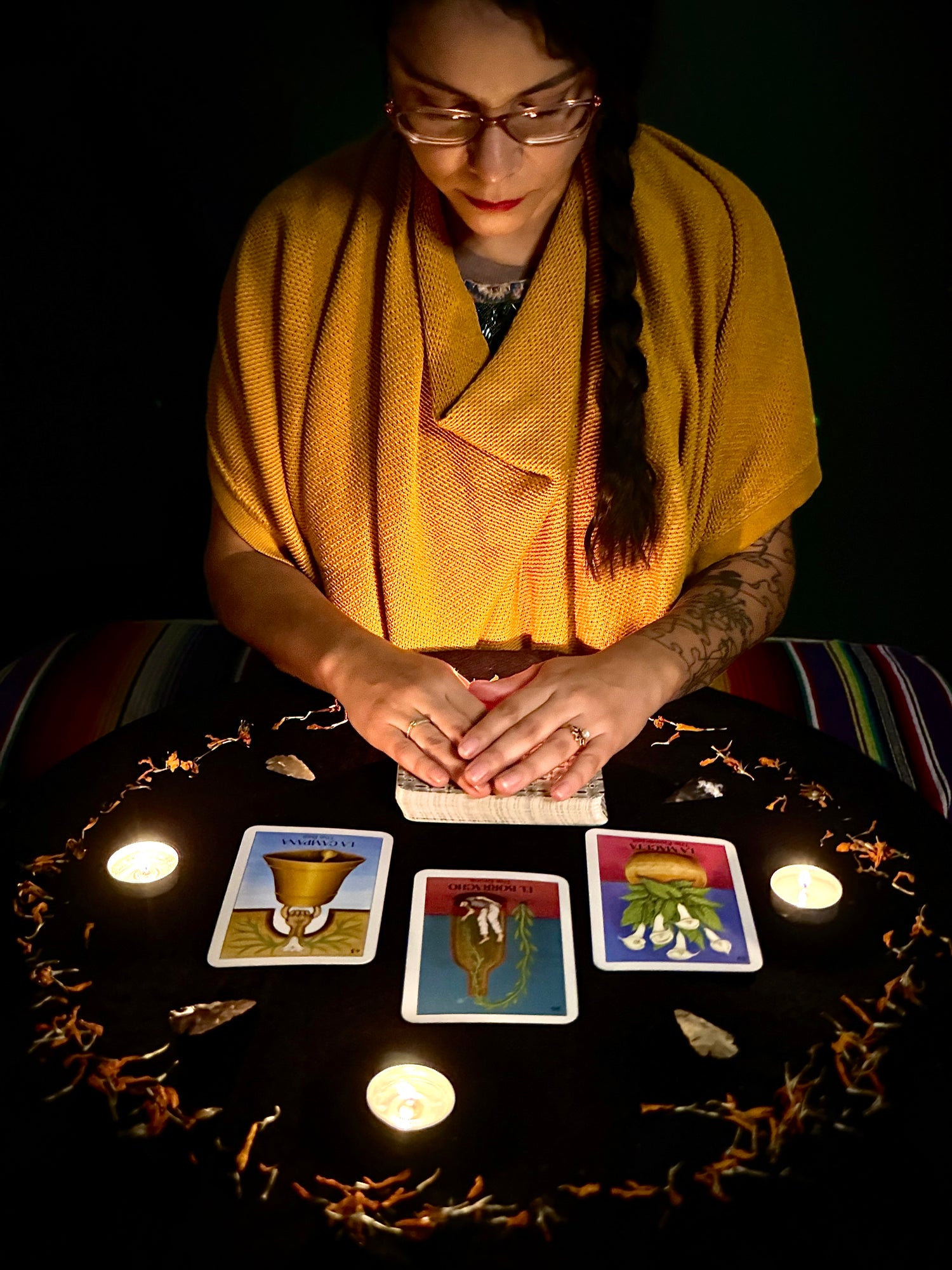 crystal, psychic medium, doing a card reading at a table with oracle cards.