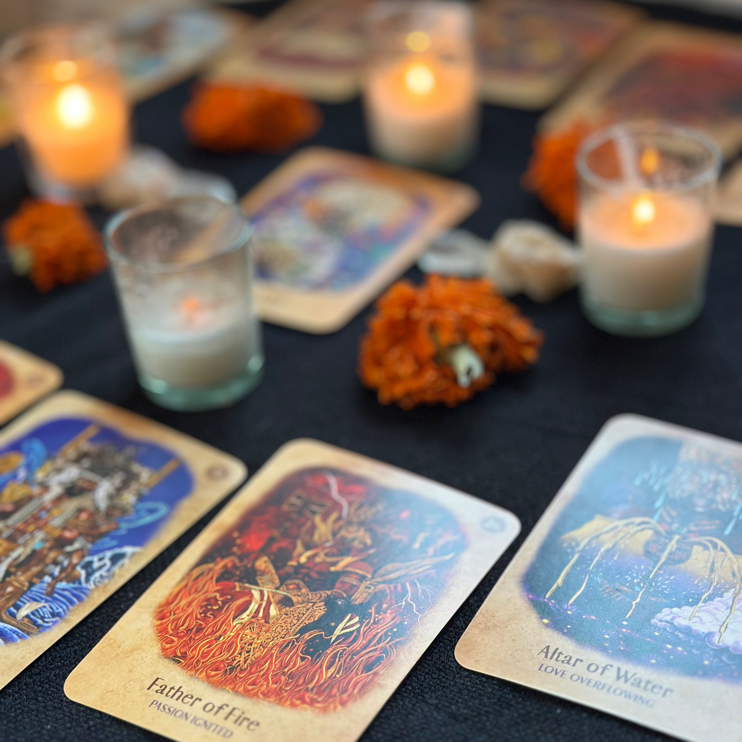 a multiple cards reading with candles and marigolds.